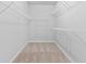 Ample storage provided with shelving in this walk-in closet at 1838 Lakeview Bend Way, Buford, GA 30519