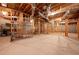 Open basement featuring exposed beams, utilities, and shelving at 223 Oak Grove Dr, Dallas, GA 30157