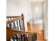 Foyer featuring hardwood floors, railing, and a chandelier at 223 Oak Grove Dr, Dallas, GA 30157