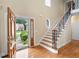 Grand foyer with hardwood floors, staircase, and decorative front door, offering a welcoming entry at 223 Oak Grove Dr, Dallas, GA 30157