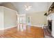 Open-concept living room with a fireplace and large windows providing ample natural light at 223 Oak Grove Dr, Dallas, GA 30157