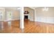 Spacious living room with hardwood floors, fireplace, and elegant chandelier at 223 Oak Grove Dr, Dallas, GA 30157