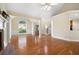 Spacious living area with hardwood floors, vaulted ceilings, and elegant architectural details at 223 Oak Grove Dr, Dallas, GA 30157