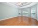 Spacious main bedroom with hardwood floors, tray ceilings, neutral walls and bright natural light at 223 Oak Grove Dr, Dallas, GA 30157