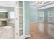 An interior view of the main bedroom leading to the en suite bathroom, both filled with natural light at 223 Oak Grove Dr, Dallas, GA 30157