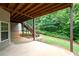 The patio has a serene view of the greenery in the backyard at 223 Oak Grove Dr, Dallas, GA 30157