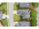 Aerial view of a well-maintained home with a landscaped yard, driveway, and neighborhood streets at 3032 Montclair Se Cir, Smyrna, GA 30080
