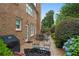 Picturesque backyard with patio, outdoor grill, lush greenery, and a well-maintained brick exterior at 3032 Montclair Se Cir, Smyrna, GA 30080