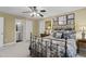Cozy bedroom featuring a wrought iron bed frame and a view into the bathroom at 3032 Montclair Se Cir, Smyrna, GA 30080