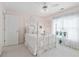 Bright bedroom with a white metal frame bed, sheer curtains, and decorative wall art at 3032 Montclair Se Cir, Smyrna, GA 30080