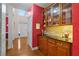 Hallway with butlers pantry, wooden cabinets and granite countertops at 3032 Montclair Se Cir, Smyrna, GA 30080