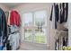 Walk-in closet with shelving, hanging racks, and a bright window view at 3032 Montclair Se Cir, Smyrna, GA 30080