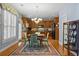 Cozy dining area with hardwood floors, vintage decor, with an adjacent modern kitchen in background at 3032 Montclair Se Cir, Smyrna, GA 30080