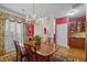 Dining room with red walls, a chandelier, and built-in cabinets, perfect for entertaining at 3032 Montclair Se Cir, Smyrna, GA 30080