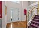 Bright foyer with hardwood floors, staircase, and a decorative niche at 3032 Montclair Se Cir, Smyrna, GA 30080