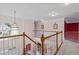 Bright hallway with hardwood railing, neutral walls, and decorative lighting fixtures at 3032 Montclair Se Cir, Smyrna, GA 30080