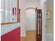Hallway with wooden floors and a grandfather clock, leading to various rooms at 3032 Montclair Se Cir, Smyrna, GA 30080