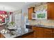 Kitchen with granite countertops, a stainless steel sink, and cherry-stained cabinetry at 3032 Montclair Se Cir, Smyrna, GA 30080