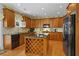 Well-equipped kitchen featuring wood cabinets, granite countertops, and center island at 3032 Montclair Se Cir, Smyrna, GA 30080