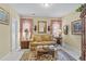 Comfortable living room with two cushioned sofa chairs and bright, neutral colors at 3032 Montclair Se Cir, Smyrna, GA 30080