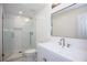 Modern bathroom features a glass-enclosed shower and white vanity at 3960 Rocmar Dr, Snellville, GA 30039