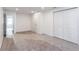 Bright bedroom features plush carpet, white walls, closet and door to another room at 3960 Rocmar Dr, Snellville, GA 30039