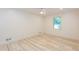 Bedroom featuring new light wood flooring, a ceiling fan and natural light at 3960 Rocmar Dr, Snellville, GA 30039