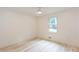 Well-lit bedroom featuring light wood floors and a ceiling fan for added comfort at 3960 Rocmar Dr, Snellville, GA 30039