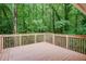 Wood deck overlooks wooded backyard with dense green foliage at 3960 Rocmar Dr, Snellville, GA 30039