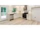 Modern kitchen featuring stainless steel appliances, white cabinets, and ample counter space at 3960 Rocmar Dr, Snellville, GA 30039