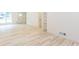 Spacious living area featuring light wood floors, built-in shelving, and neutral walls at 3960 Rocmar Dr, Snellville, GA 30039