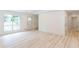 Open living space with a large window, light-colored flooring, and ample natural light at 3960 Rocmar Dr, Snellville, GA 30039