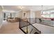 Bright bonus room with lounge area, study nook, and elegant staircase at 4224 Dogwood Bend Park, Berkeley Lake, GA 30096