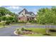 Beautiful two-story home with manicured landscaping, stone accents, and a circular driveway at 4224 Dogwood Bend Park, Berkeley Lake, GA 30096