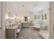 Luxurious bathroom with double vanities, a soaking tub, and a glass-enclosed shower at 4224 Dogwood Bend Park, Duluth, GA 30096