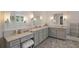 Bathroom featuring double vanity sinks, tile floors, and modern fixtures at 4224 Dogwood Bend Park, Duluth, GA 30096