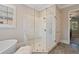 Modern bathroom with a glass shower, tile floors, and natural light at 4224 Dogwood Bend Park, Duluth, GA 30096