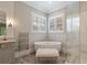 Bright bathroom with a standalone tub, separate shower, and white tile at 4224 Dogwood Bend Park, Duluth, GA 30096