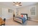 Bright bedroom with a ceiling fan, shutters, and an ensuite bathroom at 4224 Dogwood Bend Park, Duluth, GA 30096