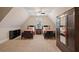 Vaulted bedroom featuring two twin beds with dark wood frames, a ceiling fan, and an armoire at 4224 Dogwood Bend Park, Duluth, GA 30096