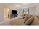 Spacious bonus room boasts a large sectional, recessed lighting, and an adjacent bathroom at 4224 Dogwood Bend Park, Duluth, GA 30096