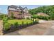 Charming two-story brick home featuring a manicured lawn and a three car garage, perfect for Gathering living at 4224 Dogwood Bend Park, Duluth, GA 30096