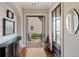 Bright foyer featuring hardwood floors, shiplap accent wall, and open doorway to an outdoor patio area at 4224 Dogwood Bend Park, Duluth, GA 30096