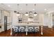 Modern kitchen with a large island, stainless steel appliances, granite countertops, and hardwood floors at 4224 Dogwood Bend Park, Duluth, GA 30096