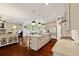 Open kitchen with a large island, stainless steel appliances, and hardwood floors at 4224 Dogwood Bend Park, Duluth, GA 30096