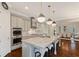 Bright kitchen with a large island, granite countertops, and stainless steel appliances at 4224 Dogwood Bend Park, Duluth, GA 30096