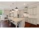 Elegant kitchen featuring a spacious island, pendant lighting, and high-end finishes at 4224 Dogwood Bend Park, Duluth, GA 30096