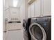 Well-equipped laundry room featuring modern appliances and ample cabinet space at 4224 Dogwood Bend Park, Duluth, GA 30096