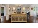 Open living room with a fireplace, built-in bookshelves, hardwood floors, and neutral color palette at 4224 Dogwood Bend Park, Duluth, GA 30096