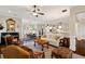 Open-concept living space with hardwood floors, neutral palette, connecting the living room, dining area and kitchen at 4224 Dogwood Bend Park, Duluth, GA 30096